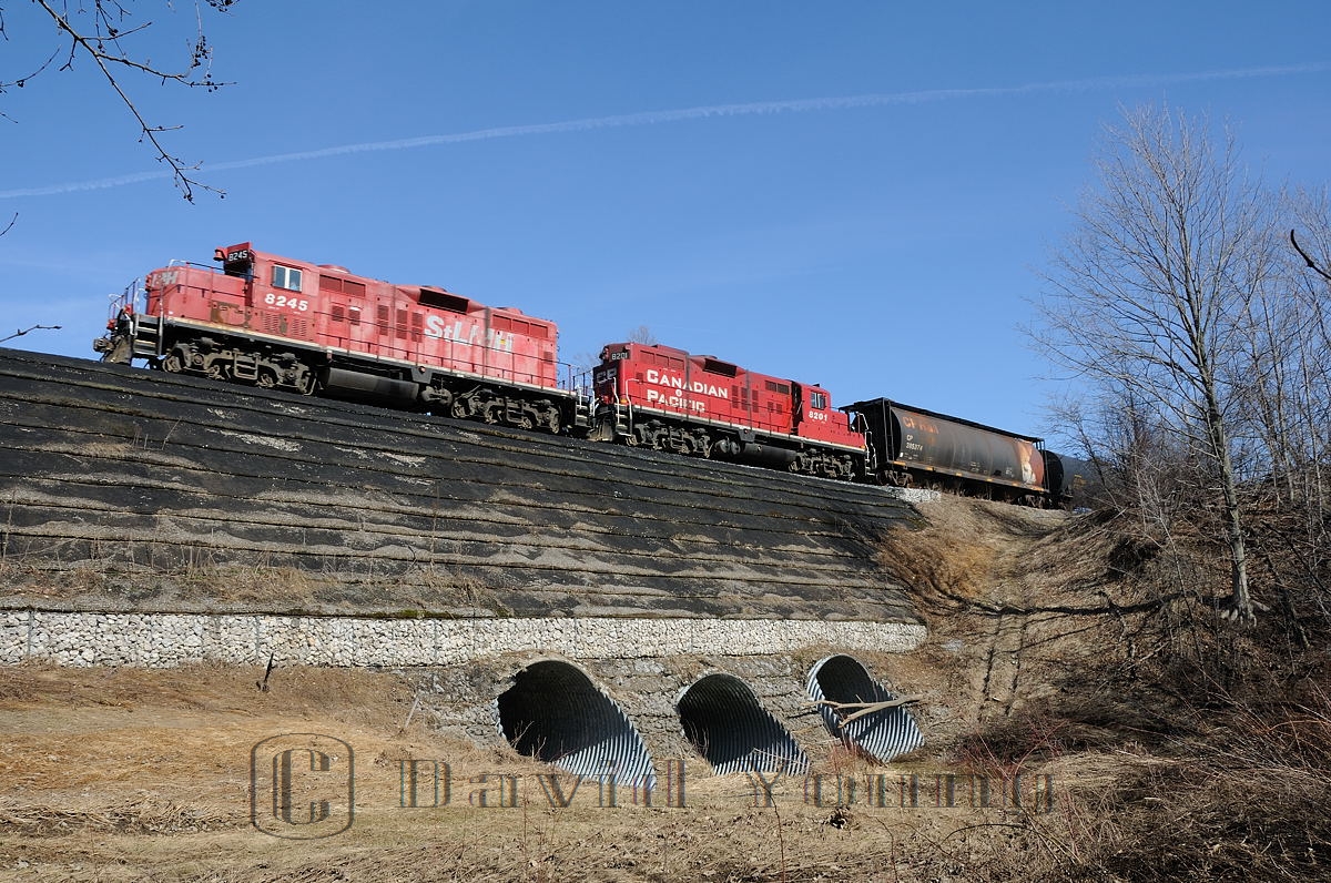 Do you want to play a game? Guess the location of this image...
Clues: TK12 with GP9u's STLH 8245 - CP 8201 and a short 3 car freight destined for St. Thomas. Two cars are destined for interchange with the STER, while the hopper is just along for the ride, being used as a buffer and will get setoff on the return trip at Putnam.