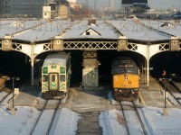 Making its timely 16:30 departure from Toronto with Milton-line GO train #151, GO cab car 238 pulls out of Track 7 of Union Station's train shed (the then-usual track for Milton trains), passing the yellow nose of VIA F40PH-2D 6408 sticking out of Track 8 on train #83, still a good 45 minutes away from its 17:15 departure time.
<br><br>
At this time, it was still dark underneath the 1920's Bush-style train shed - work was still a year or two away from "cubing" it with the giant glass atrium (although some use a far more foul term).