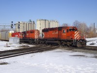 Prior to the grade separation project, an eastbound CP train crosses over the Weston Sub on a beautiful day back in March 2008.