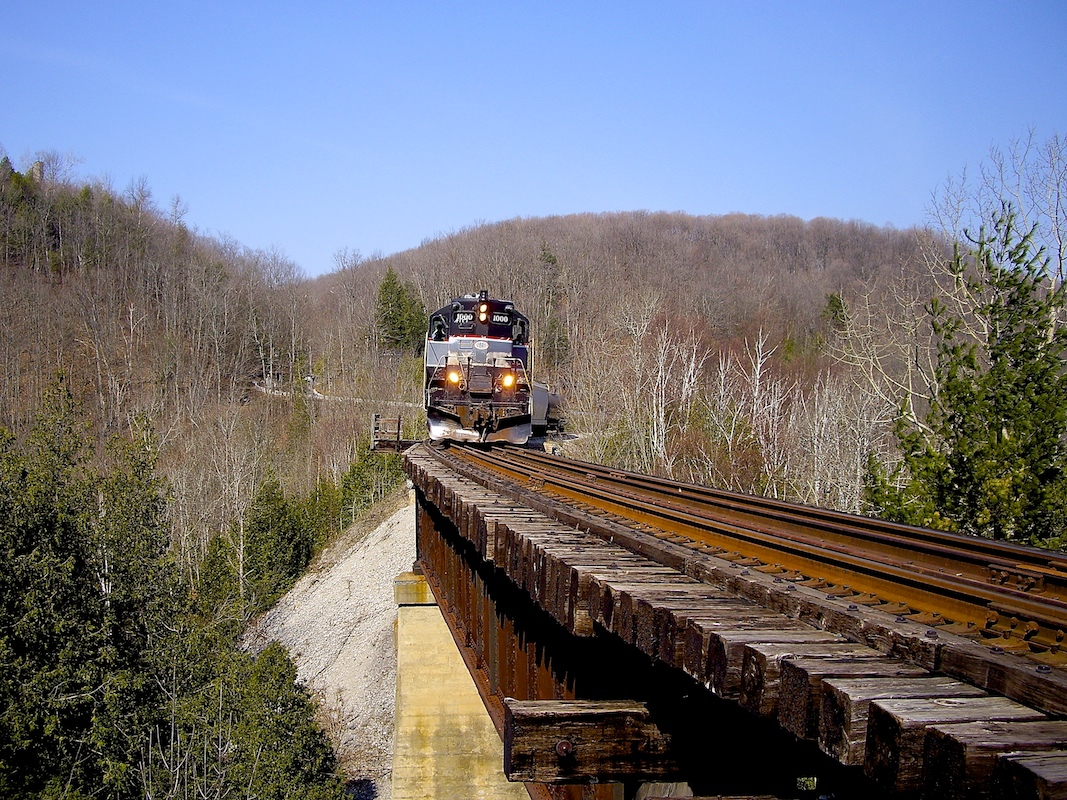 CCGX 1000 slowly leads OBRY's biweekly freight train over the curved trestle near Belfountain.