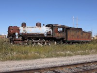 219, a 4-6-0 locomotive built by MLW in 1907, sits in Cochrane Yard surrounded by years of plant growth.   She was originally numbered 119 for the Temiskaming and Northern Ontario Railway, renumbered in 1935 and then sold to Normetal in 1938.  Ontario Northland required her in 1975 for a planned excursion train that never did materialize.  The Northern Ontario Railroad Museum and Heritage Centre bought her in the summer of 2012 for the sum of $5001, and was eventually transported to their facility at Capreol in the spring of 2014.  When I stumbled across her she was clad in a coat of sealant (to prevent aspestos from leaking into the environment) as well as missing a smoke stack (which has since been reattached).