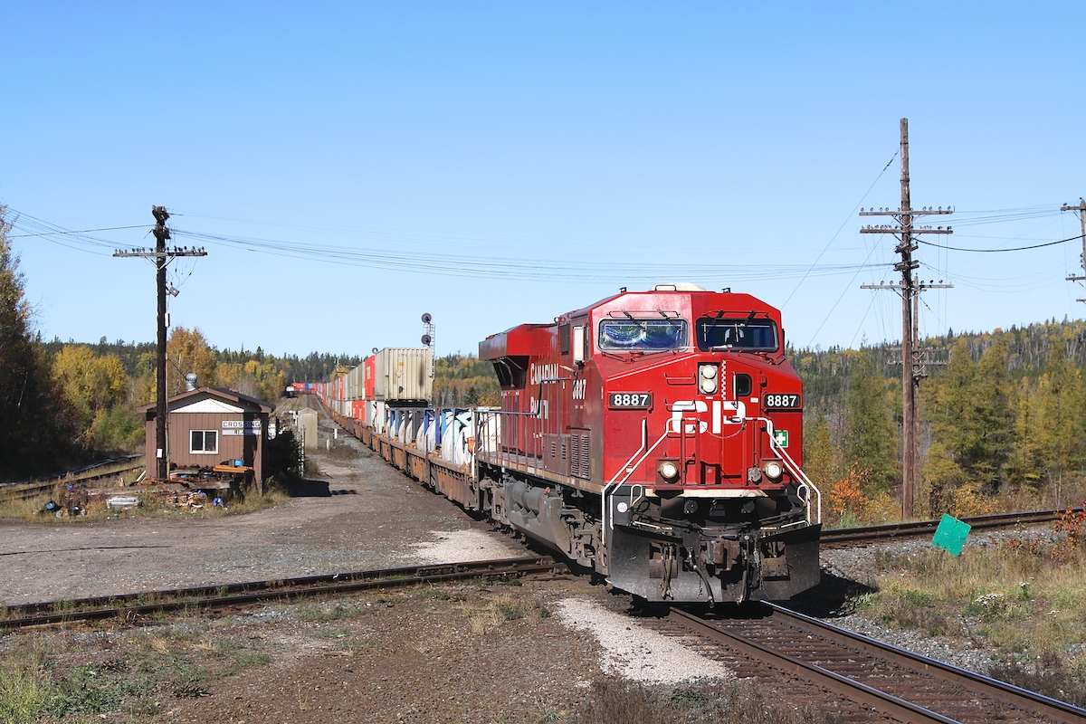 CP 8887 leads a eastbound container train over the diamond at Franz.