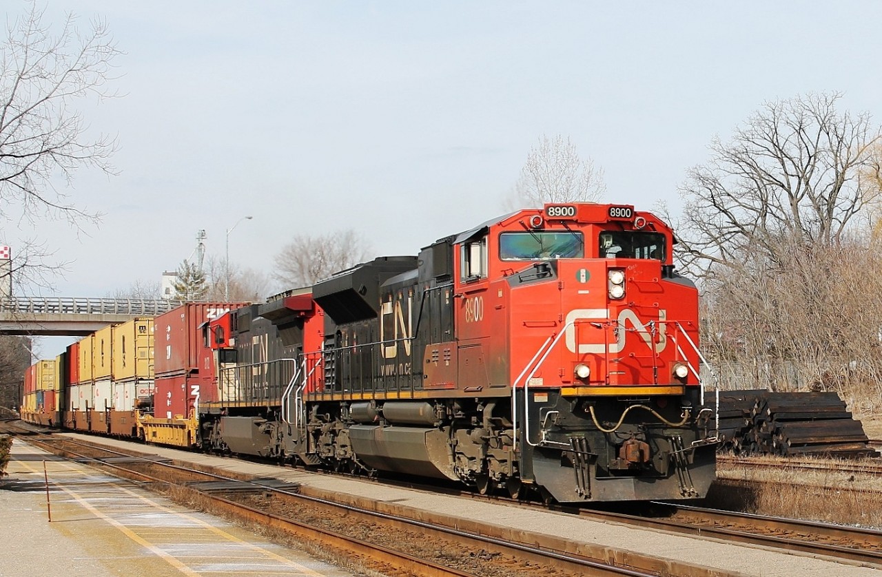All intermodal 148 powers through the station and up the bank with 8900 and 2172 in charge.