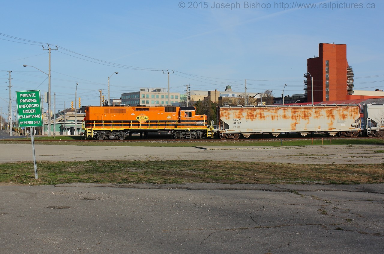 SOR 496 eases to a stop before Icomm Drive with QGRY 2301 leading long hood forward down the Burford Spur with cars for Ingenia.  In the background is the Beckett Senior Centre and the Market Centre Parkade.  This morning as I was heading to my teaching placement, I turned left onto Clarence and a quick look to my right saw a set of head lights so I made a slight detour to grab a few shots.