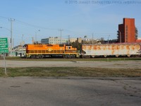SOR 496 eases to a stop before Icomm Drive with QGRY 2301 leading long hood forward down the Burford Spur with cars for Ingenia.  In the background is the Beckett Senior Centre and the Market Centre Parkade.  This morning as I was heading to my teaching placement, I turned left onto Clarence and a quick look to my right saw a set of head lights so I made a slight detour to grab a few shots.
