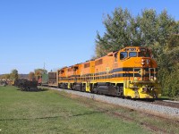 A trio of ex-CN geeps bring their train, consisting of manufactured product from Essar Steel Algoma, through Echo Bay on a beautiful autumn afternoon.