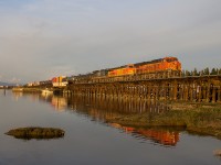 A southbound BNSF from CNs Thornton Yard crosses Bridge 69 at the south end of Mud Bay in Surrey, BC on a nice, sunny evening. Note the CSX C40-8, a neat find, mixed into the power. 