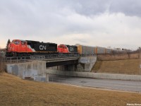After spending a nice relaxing day track-side at various locations along CN's York Subdivision's, with the day coming to an end I was treated to a eastbound autorack train with CN 5726 leading Illinois Central 9573, which was online and working. 9573, was built in 1972, and is a EMD GP38-2 locomotive with 2000 horsepower to it, and its maximum speed being 65mp/h. With only 14 left, this was my first time seeing one of these and probably one of the last.