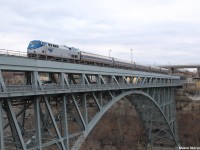 Amtrak's Maple Leaf runs from New York City to Toronto in Canada and vise versa, transporting passengers who are going for all sorts of reasons - business, vacation and more. With the dropping amount of customers on the train specifically in the portion running in Canada, the train may be taken off of Amtrak's schedule or run less frequently. Currently, there is 1 run in each direction daily of the Maple Leaf. The Maple Leaf is also 1 of only 3 Amtrak invaders into the territory of Canada, leaving it a fairly unique opportunity to be able to catch one. Here, P42DC 174 is on point of now VIA 98 crossing into Canada from the USA across the Niagara River in Niagara Falls.