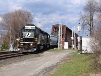 Norfolk Southern train H53 is a transfer that runs from the Buffalo, NY area into the province of Ontario via what is known as the International Bridge located in Fort Erie, ON and Buffalo, NY. The bridge spans the Niagara River, and receives around 5-7 trains on normal days. Here, H53 is pictured with 2 of NS's SD40-2 locomotives idling for a RTC clearance and the engineer taking a short break outside. Minutes later, they fired the bad boys up and took off northbound towards Welland.