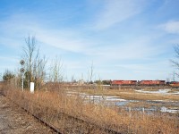 After meeting CP 550 at Baxter, 119 chugs uphill through Utopia with double stacks in tow. Like usual, there is no DPU for this Edmonton bound stacker. Here, it crosses the now abandoned section of the BCRY Meaford Spur. Shortly before abandonment in 2011, a One Way Low Speed (OWLS) diamond was installed to reduce maintenance. However, only a few months later, the line was abandoned, and the diamond has since been mostly dismantled. The signals, however remain turned on, and I guess they will display solid red until the bulbs fade out. The Meaford, built in 1855, is one of the oldest rail lines in Canada, and is a half a century older than the MacTier. Evidently though, the MacTier has had much greater success, being a transcon route. It would be a pity to see the Utopia-Collingwood section of the Meaford torn up, however rail trails seem to be the way of the future. Personally, I'd love to see the BCRY operate a Barrie-Collingwood heritage train, much like sister railroad OBRY does. Only time will tell though.