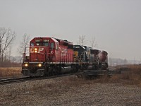 CP 255 had pretty decent power. Too bad the SD40-2 wasn't in the lead. Oh wait... Change of plans. 255 had arrived in Welland with CP 9808 leading in the morning, and its radiator went on a protest. Many hours later, 5966 is leading the power in the opposite direction (east) to Brookfield, where they will be able to wye the power so 5966 can lead 255 to Windsor. The crew wasted no time, and has gotten up to track speed in less than half a mile after leaving O'Reilly's yard. In second is CSX (ex Seaboard) 8539, and 9808 with a steaming radiator in third. In about 40 minutes, 5966 will be in the lead again heading west ripping through the level crossing at Philips Road. 255's power coupled to the train shortly after that, and headed towards Hamilton.