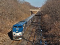 I typically don't have interest in getting a picture of the Amtrak Maple Leaf, however why not. After all, it's a dying breed. This Toronto bound is slowing for its regular stop at St. Catharines. The crew is for sure extra alert as this area is infested with trespassers, two of which were under the bridge I was standing on. After seeing this train several times in the past couple of weeks, ridership has been at a frightening low, due to increased competition from GO Transit. Twice recently nobody has gotten on or off at St. Catharines, and the train definitely lacks passengers. Maybe I'm just paranoid, but I'd be grateful this American invader still exists. It is one of only three of its kind in Canada, and it is surprising to me that it is still around.