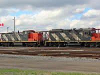 No debating which country this photo was taken in. With the Canadian flag flying in the wind, one of the remaining GMD1's on CN roster sits awaiting the next assignment. 