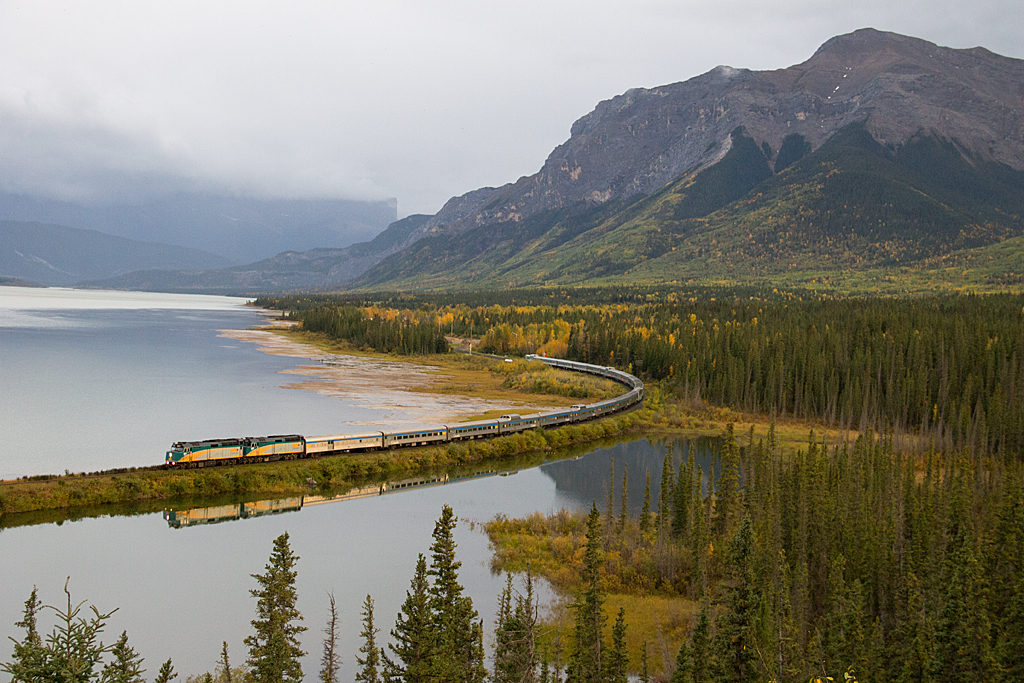 During an evening at Swan Landing, overlooking Brule Lake, we would experience thick clouds, along with a number of rain systems covering the mountains, on the east side of Jasper National Park. Fortunately our timing would work out, as the rain clouds would clear up and brighten just in time for Canadas Premier passenger train "The Canadian" to blast on eastward. The calm waters provided a nice reflection too.