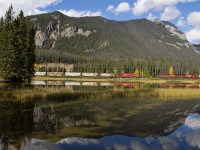 CP 8851 east is coming into Field for a crew change, meets westbound CP 9605 at the west end of the yard at Field. The reflection and sunshine added a nice effect to the image.