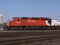 Large multimark 5863 leads a sister SD40-2 back onto the yard tracks at the end of a working day.