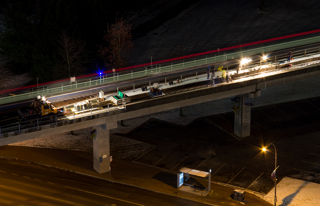 Another example weeks later of the Skytrain power rail upgrades, which happened in the late evening. This time, the machinery used by crews is present and crews are busily working away. During this time Skytrain was run into King George Station using the inbound track as outbound.