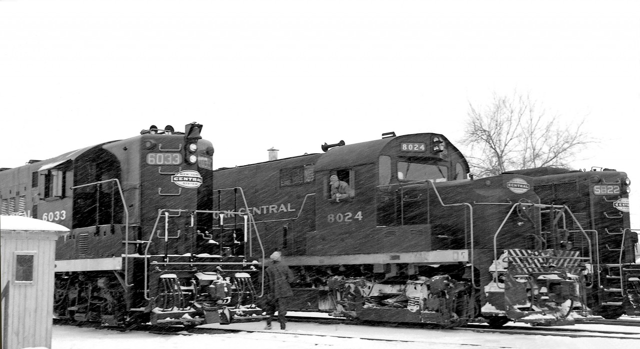 A busy day for the New York Central at Hagersville ON: EMD GP9 6033, ALCO RS36 8024, and Canadian-built and assigned GMD GP7 5822 are lined up on a snowy Winter's day on the CASO.