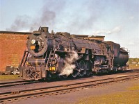 Trivia Time:  What was this “Northern-Type" called when it was first produced?
<br />
<br />
Class U-3a, #6305, was built by the American Locomotive Company (Alco) for the Grand Trunk Western in July, 1927.  The Grand Trunk Western Railroad was the US subsidiary of the CNR.  Just twelve locomotives of this specific class were built (6300 – 6311).  She was retired / scrapped in March, 1960.  Trivia Answer:  “Confederation”. 
<br />
<br />
Mr. Rosamond captured this sunset scene at the Niagara Falls roundhouse, circa 1959.   

