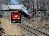 Welcome to the North End of Hamilton. TH31 is heading back to Kinnear on CP's Hamilton Belt Line (ex TH&B) and passing under the CN Grimsby Subdivision. Also seen is an abandoned Dofasco pedestrian overpass, once used to connect a parking lot out of sight at left, under the CN right of way to the sprawling Dofasco facilities on Beach Rd. The other end of the parking lot was also the location of the TH&B's 'Little Belt line' and the switch for the little belt was about 1/2 mile behind me near Barton St.<br><br>Hamilton watchers would also be interested to know, the former Consumers Glass (a TH&B customer) has also been razed to the ground not far from here.<br><br>Any TH&B fans with photos from these areas to share? I'd more than welcome seeing some from the north end of Hamilton in its glory days :)