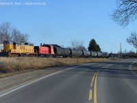 In the 'interesting lashup in 2015' department - here's an OSR train I happened upon while driving west on the 401 on the 17th. A detour for a quick photo, and back on the 401 I go.<br><br>
In this scene, OSR's St. Thomas job is returning to Ingersoll with 24 cars from the CN interchange at St. Thomas. Previously, this traffic ran over the STER to Tillsonburg, which now makes for much longer St. Thomas trains for the OSR.