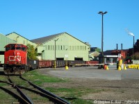 The Southern Ontario Railway, with leased/assigned CN 4776 rounds the curve by the guard shack at Stelco with a cut of NS family gondolas filled with steel billets. At the time of this photo, Stelco was going gangbusters pumping out raw steel while US Steel had for all intents bought the plant, the deal still in the closing phase. US Steel share price at the time of this photo (during acquisition)? Nearly $100. Today? $20