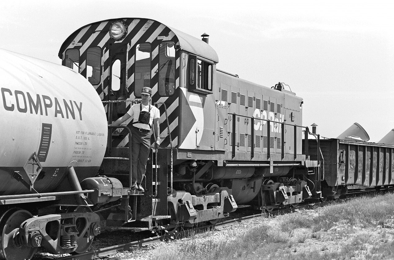 My friend, Terry, and I heard that there was some action on the spur line near Thermos Road and Bertrand Avenue in Scarborough.  We jumped on our bikes and headed down to inspect.  I’m guessing that we were about 14 years-old.  The engineer was kind enough to invite us to ride with him as the crew shuffled the train around.  This was the first time that I had been in a locomotive – and it was Awesome!
 


Not surprisingly, I see from the satellite-view that this line has long since been removed.  
  

  
DS-6m, #6617, was built by MLW in 1959.  The locomotive was retired in February, 1982.