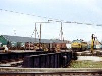 More of a historical image than artistic effort, this scene at the yard and turntable in Timmins is but a distant memory. In this image we see ONR 1519, as well as four paint varieties of 40 ft boxcars; one of which is wooden and probably served as a storage car back then. And the heavyweight coach could have been a Kitchen Car. I'd be interested if anyone could tell me what year the line into Timmins was torn up. Passenger service from Timmins to Porquis Jct ended at the startup of the Northlander in late 1977. The rail station still survives as a bus terminal.
