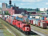 Heading through Hochelaga yard to the Port of Montreal, a transfer freight is led by CP 8921, the unique MLW RSD17.