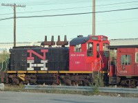 CN RS1200 sits in Don Yard, disguised as a New Haven switcher.  Apparently repainted for a film shoot, only one side got the movie treatment as I recall .  Date is approximate, sorry didn't keep good notes.