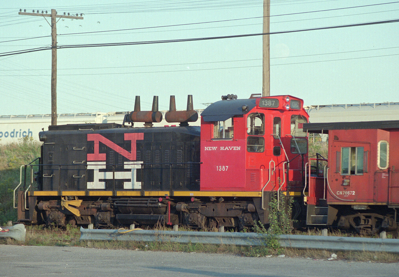 CN RS1200 sits in Don Yard, disguised as a New Haven switcher.  Apparently repainted for a film shoot, only one side got the movie treatment as I recall .  Date is approximate, sorry didn't keep good notes.