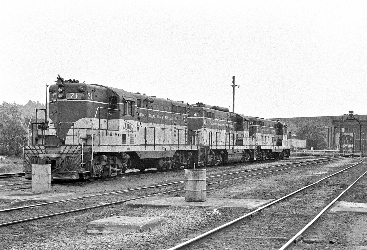 On a overcast day in 1977, this trio of power awaits the next assignment.