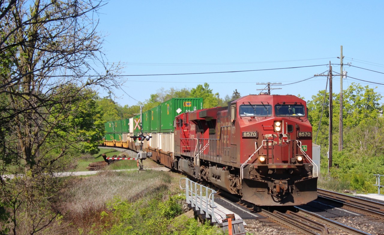 CP 8570 leads CP 8882 across Canyon Road and over last years newly constructed bridge over Limestone Creek at MM37 on the Galt sub.
