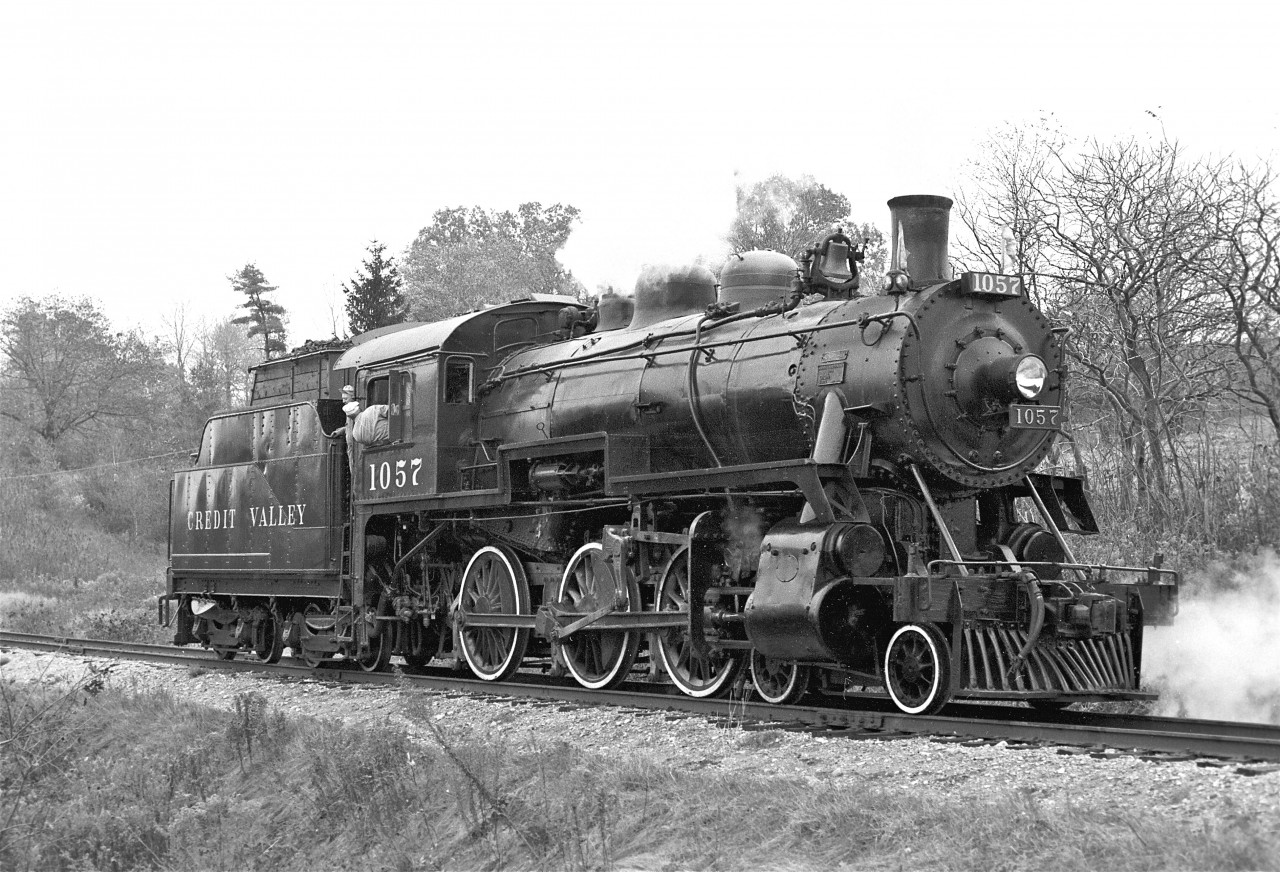 The late Frank Bunker stands in the gang-way of #1057, circa 1977.


I had joined the Ontario Rail Association around 1975.  This volunteer group worked out CPR's John Street roundhouse.  Locomotives under their care included #1057, #136, and 1201.  


It was a magical time for me... I was in my mid-teens and I was completely fascinated by these steam trains.  I met some incredibly nice people and I learned a lot.  It was fun to get my hands dirty!  We had regular work sessions about three times each week.  On excursion days, we could be invited to ride the train for free.  The coveted privilege was a cab ride.


I had my first cab ride in #1057.  I still have very vivid memories of that occasion... 


	 Mr. Bunker was at the throttle.  It was a cool, fall evening.  I was surprised by how much the cab swayed while we were running.  I remember the sweet smell of the steam, and the fantastic sounds... the bell... the whistle... the exhaust resonating from the smoke stack.  I recall the good-natured camaraderie of Frank and the guys.  I can still see the crowds of people waving from nearly every roadway-crossing we passed.  It was Awesome!!
