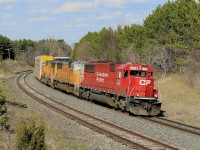 6228 and two UP engines bring 400 feet of autoracks around the curve at Coakley.