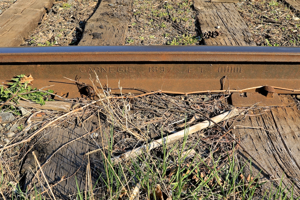 I had head from an OSR conductor that some track in the St. Thomas Sub's Beachville siding was made up of pre-1900 forged rail.  This was the oldest I could fine.  Anyone know of anything older in Canada that is still in regular use?