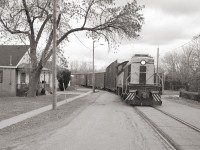 Port Colborne Harbour Railway 308 pulls a string of boxcars up Townline Spur on its way to Interlake Paper in Thorold.  PCHR 308 was built for the Erie RR in 1946 by Alco.