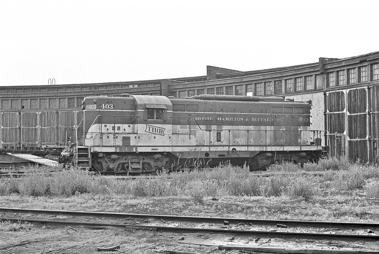 On a perfectly overcast day, GP-9 #403 rests at the Chatham Street roundhouse.  Here are some locomotive details...


- Built by the General Motors Diesel Division (London, Ontario) in March, 1954.


- Equipped with steam boilers for passenger operations


- Constructed to operate long-hood forward

	
- Equipped with Automatic Train Control to permit operation in the lead position on New York Central lines east of Welland, Ontario


- Rebuilt as CP Rail GP-9u, #1689 at Angus Shop, Montreal, in February 1988


(Information Source:  www.thbrailway.ca)