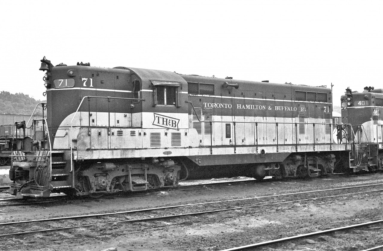 GMD, #71, sits idle near the Chatham Street roundhouse.

 
Less than three years later, this historically significant GP-7 would be destroyed in a fatal collision.  Mr. Arnold Mooney attended and photographed the tragic scene.  Check out his image and caption for more details…


http://www.railpictures.ca/?attachment_id=7294


Mr. James Adeney filmed the wreckage back at the roundhouse…


http://www.railpictures.ca/?attachment_id=8594