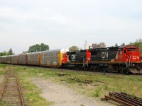 CN 2121 - BLE 902 (freshly painted in CN red and black)lead 91 cars on CN 332
