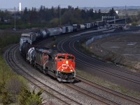 CN 376 rounds the curve at Whitby as it escapes some rolling cloud cover.