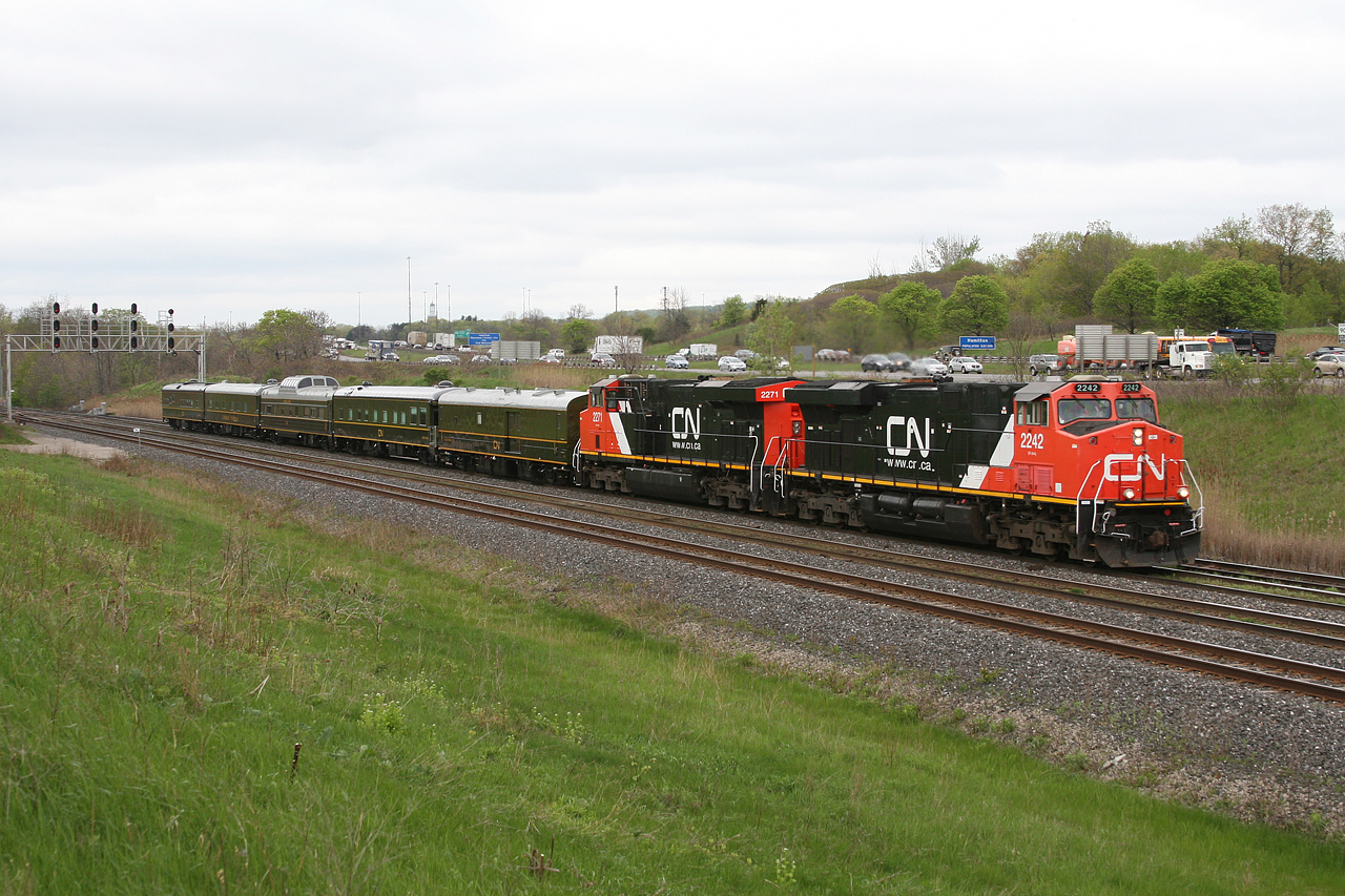 CN P 60031 13 has made excellent time across South Western Ontario, passing through Snake at 0935; 2 hours and 35 minutes since departing Sarnia.  After a quick jaunt across the Oakville Sub, P 600 will blast across the Halton sub for a brief crew change at Goreway, before continuing eastwards to Montreal.

The consist was as follows:
CN 2242, CN 2271, "Fraser Spirit", "Great Lakes", "American Spirit", "Tawaw" and "Sanford Fleming" all sporting the attractive Green and Gold scheme.