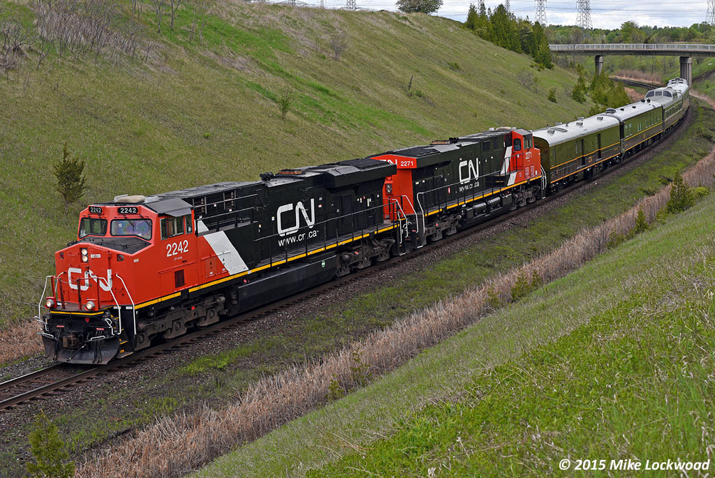 With the whole gang on board, P600 drops down the hill at Beare on the approach to the siding of that name and shortly, the junction with the York Sub. Clean CN 2242 and 2271 make a nice looking, if not terribly interesting, set of power. 1138hrs.
