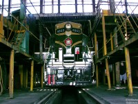 On April 29th 2007, a group of individuals from the Guelph Historical Railway Association (including some friends-of-friends such as the photographer) were offered a then-rare glimpse inside the long-shuttered, unrenovated former CPR John Street Roundhouse, on a guided tour by historian Derek Boles. Slumbering in the dark confines of Stall 20, CN GP7 4803's paint is still fresh from when it was repainted at Pointe St. Charles shop for donation to the City of Toronto in 1984 (it had previously been serving as Transcona's shop switcher in Winnipeg, numbered 1, while many of her sisters languished in the deadline there or were parted out and scrapped). 
<br><br>
As mentioned, the tour of the roundhouse was before the westernmost 2/3rds were renovated and converted into a museum and Leons retail space. Aside from equipment and pieces stored inside (like the entire 90-foot turntable), the roundhouse atmosphere retained a sense of how it probably felt in its final days during the mid-80's when CP operated out of it. The gangways along the roundhouse drop pits (most were still open and unfilled) serviced 1940-50's vintage Alco/MLW switchers in the final years of John St., and over the years Budd RDC cars, GMD and MLW F-units for The Canadian and other passenger trains, and before that passenger steamers such as Royal Hudsons, Jubilees, Pacifics, and even the famed duo of 4-4-0 136 and D10g 4-6-0 1057 (although John St. for most of its life was used to service passenger engines and equipment, due to its proximity to Union Station. Most of the freight engine servicing was done at Lambton and West Toronto roundhouses).
<br><br>
The site has since become home of the Toronto Railway Historical Association. Despite only having a few of the 32 stalls to work out of, a large museum presence on the grounds outside and visible to the passing public makes up for interior quarters, and helps cement the museum as part of the downtown urban area.
