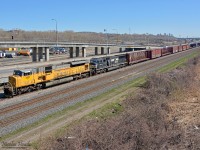 NS 7301 (Ex-UP 8073 EMD SD9043MAC) and NS 6776 (Ex-Conrail 5523 EMD SD60M) lead CN 529 as it approaches Turcot West. NS 7301 was bought in September 2014 from Union Pacific, and still has UP colors.