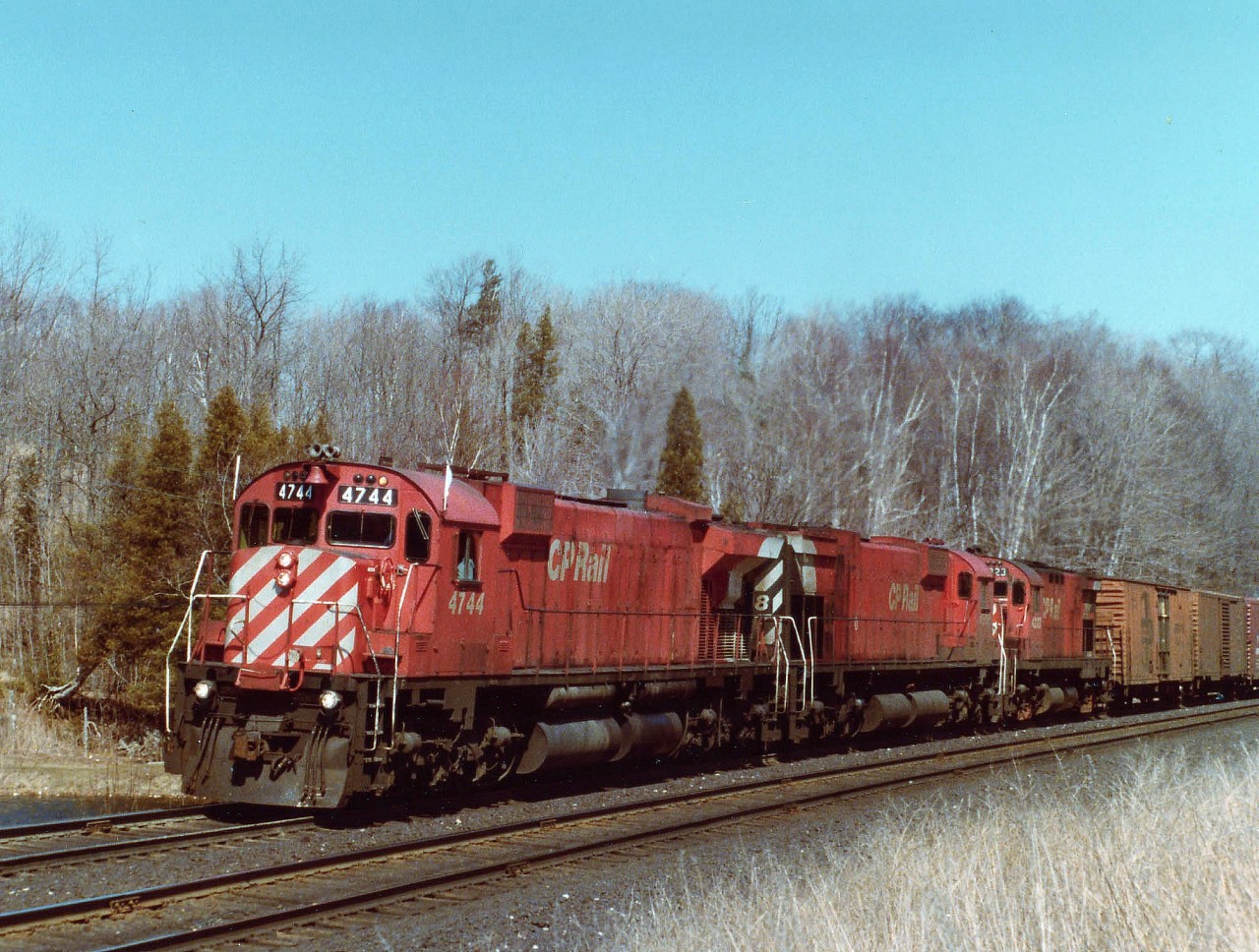 Although just as rare as that other One-of-a-Kind CP locomotive, MLW RSD-17 #8921 that used to get the fans in some sort of a frenzy, this MLW 4744, an M-640; the only locomotive of its type in the world, probably gathered nowhere near the attention as it lead westbound CP 4568 and 4223 toward Guelph Jct. The M-640 is basically the same as the M-636, 18 cylinders vs 16, and a much larger radiator space at the rear of the hood. It was rated 4000 HP. Never went into production past this demonstrator as ALCO ended up closing shop. The CTG says it was retired in 1992 and went to the Canadian Railway Museum in 1998.