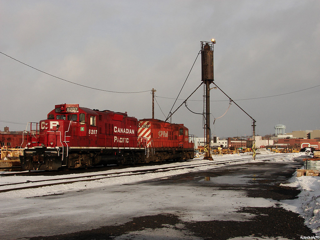 CP 8207 and 8224 basking in the evening sun waiting for their next assignment under the fuel stand in the shop tracks at Sudbury. 8207 is one of the few remaining GP9u's currently serving the London area, while 8224 was retired in late 2011 and sent to the SRY for parts salvaging and scrapping.