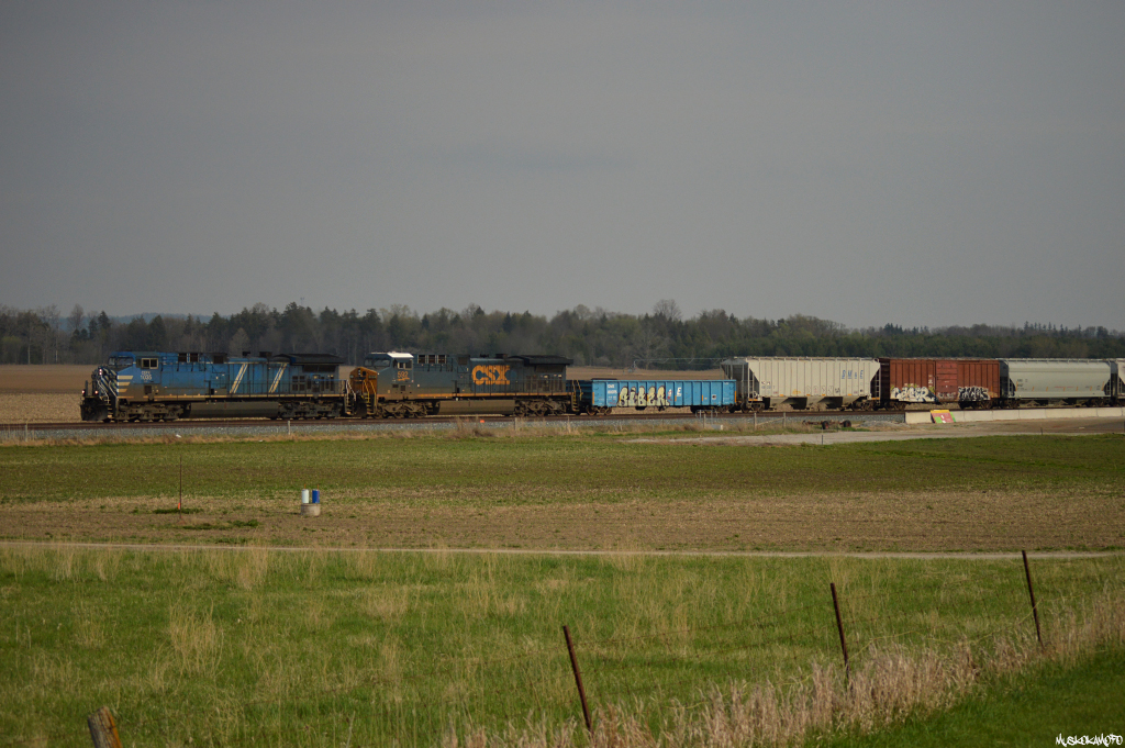 CEFX 1035 North highballs through Baxter with a nice splash of American blue on the head end of this evenings 421, after an extensive amount of work at Spence a few miles to the South.