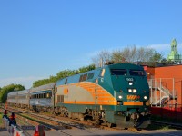 VIA 902 is leading VIA 39 over the De Courcelle crossing on a sunny evening. VIA 39 is bound for Fallowfield in suburban Ottawa.